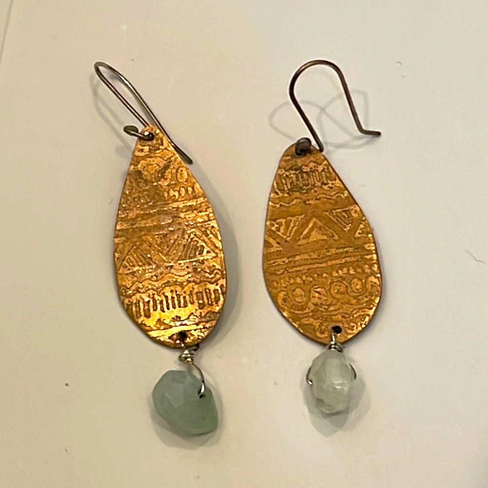 One of a kind stamped brass earrings with raw aquamarine. Really beautiful.